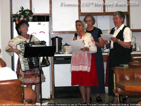 Czech women playing and singing at Notre Dame Convent; here, we heard the history of Notre Dame, and were also able to buy fresh-baked Kolaches ... until they sold out! Left to right: Sr Stephanie Matcha ND (playing accordion), Sr Christine Elias ND (wearing Czech outfit), Sr Mary Ann Zimmer ND (taller in back), Sr Celeste Wobeter ND (with black vest).